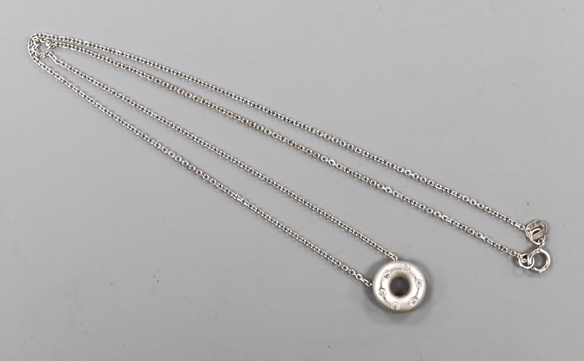 A modern 14k and diamond chip set pendant necklace, 41cm, gross weight 2.9 grams.